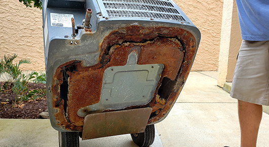 A corroded HVAC unit that should absolutely be replaced.